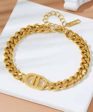 Goudkleurige Schakelarmband met D-r-Stijl Embleem